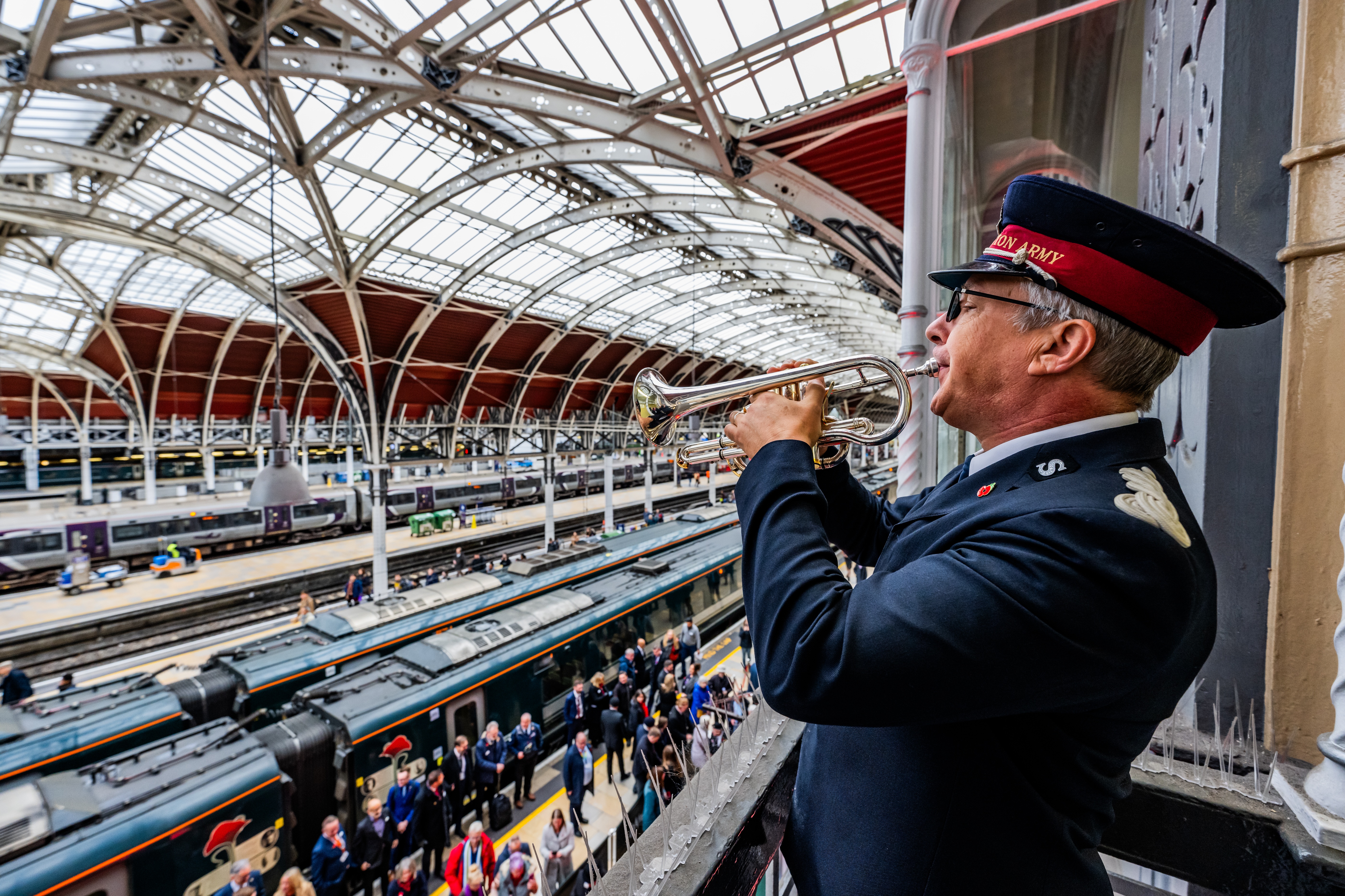 Nigel Hill from the Salvation Army plays the Last Post at Paddington