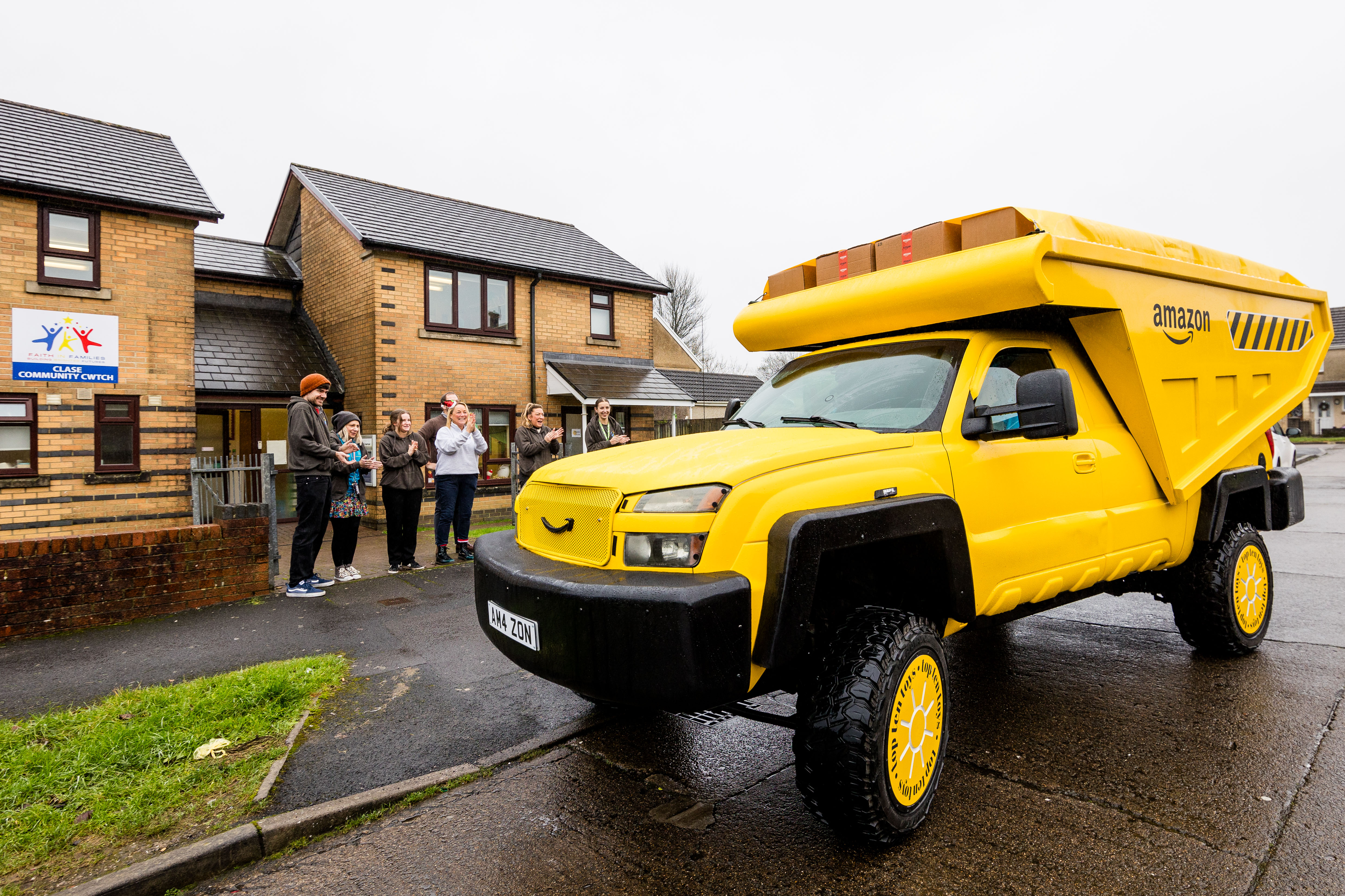 Hundreds of Amazon's Top Ten Toys for Christmas are being delivered to Faith in Families in Swansea via a giant toy truck.
