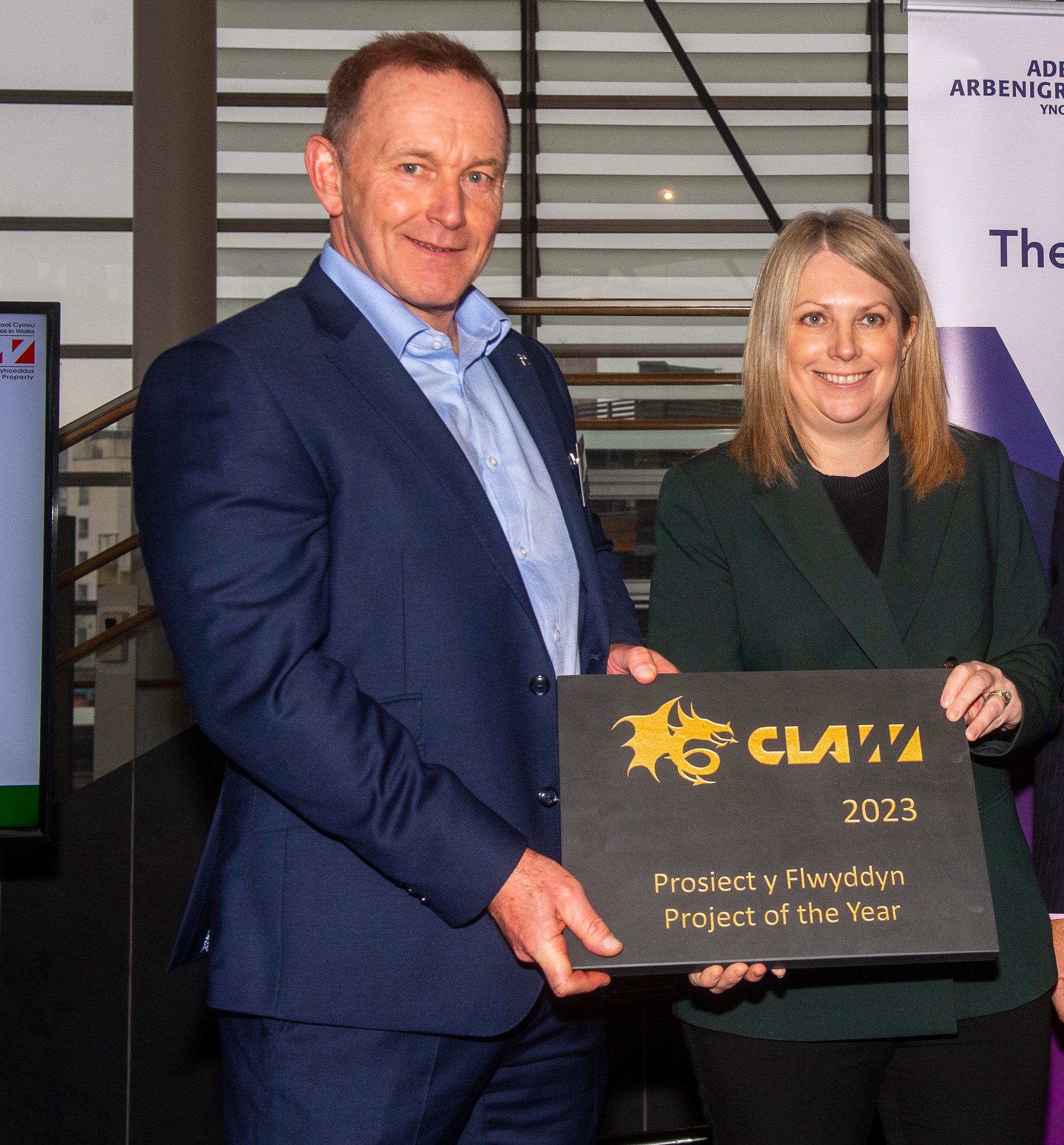 Neath Port Talbot Council Principal Projects Officer Nicholas Richards receiving the CLAW Award from Hannah Blythyn MS, the Welsh Government Deputy Minister for Social Partnership.