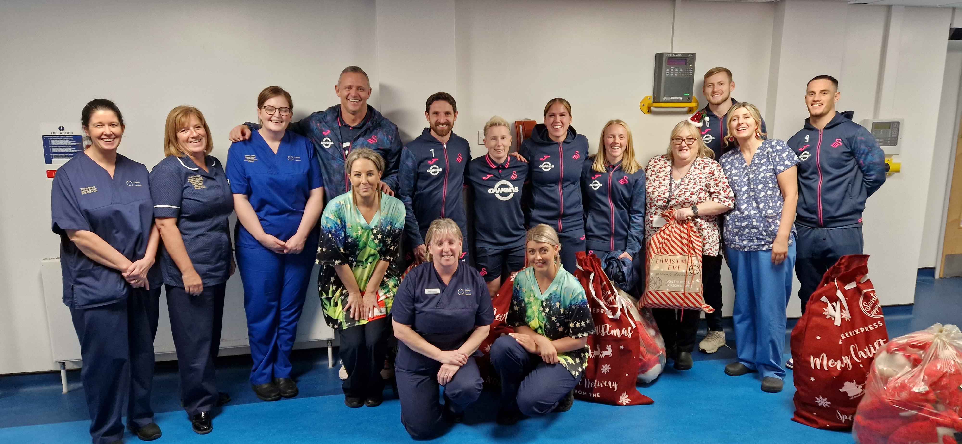 Staff met up with the Swans before they headed to the paediatric wards to spread some early Christmas cheer to young patients.