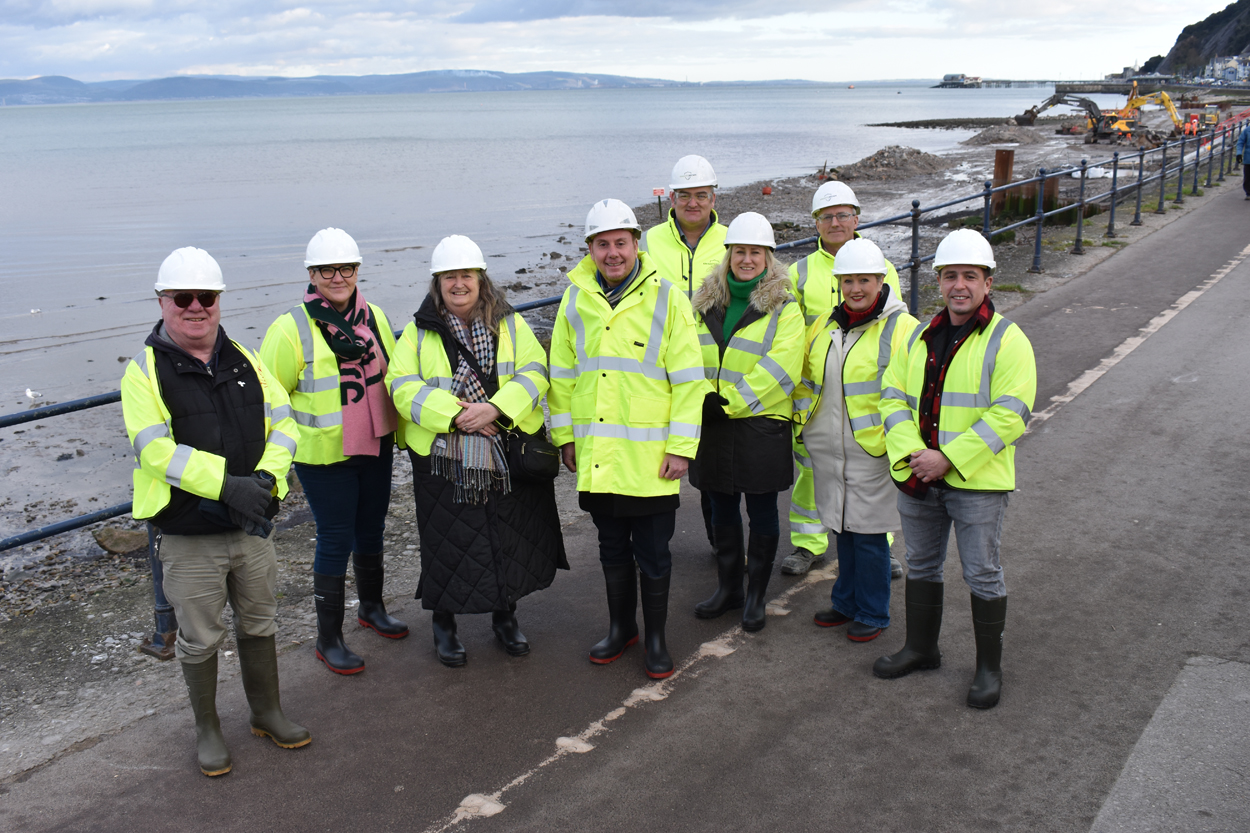 Touring the Mumbles sea defences project, with representatives of main contractor Knights Brown, are councillors Rob Stewart, Andrea Lewis, Andrew Stevens and Cyril Anderson, of Swansea Council, Wales minister for climate change Julie James, Senedd Member for Gower Rebecca Evans and Gower MP Tonia Antoniazzi.