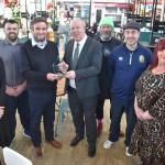 Swansea Council joint deputy leader David Hopkins, Swansea Market supervisor Darren Cox and Swansea Market Traders Federation chair - and Market Spares stallholder - Wayne Holmes with colleagues from the market, including: the council's Sarah Lawton; Debra Bissett, of The Baby Room stall; Gareth Evans, of the Get Fresh stall; and Ian Curtis, of the Storm in a Teacup stall.