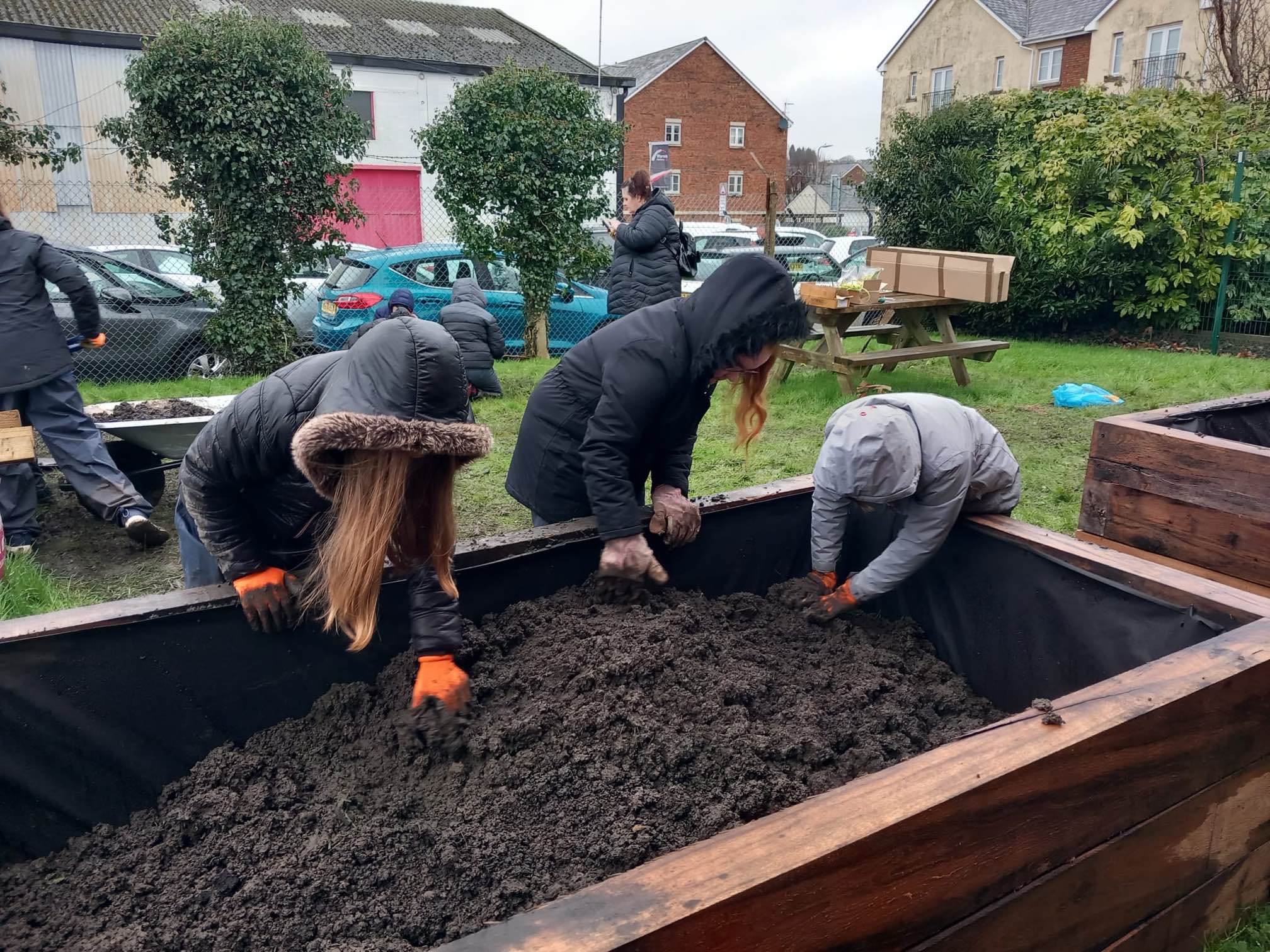 Schoolchildren from Pontarddulais Primary school help create a wildlife garden at their local fire station.