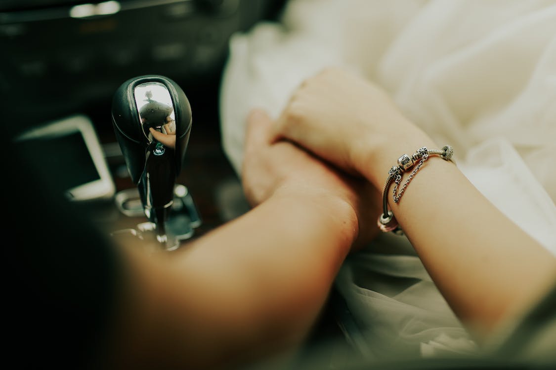 holding hands whilst driving