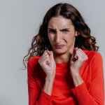 a woman with a disgusted facial expression