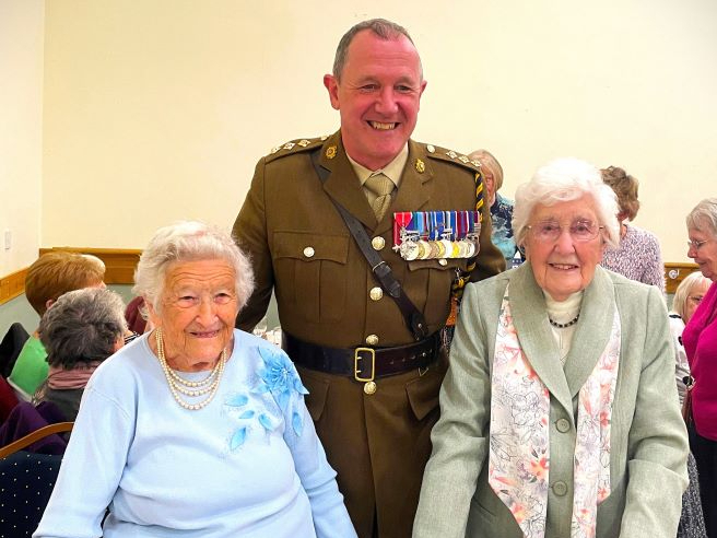 Mrs Kath Morris (right blue jumper) pictured at St Theodore’s Parish Hall with Captain Williams and Mrs Gwenfron Picken.