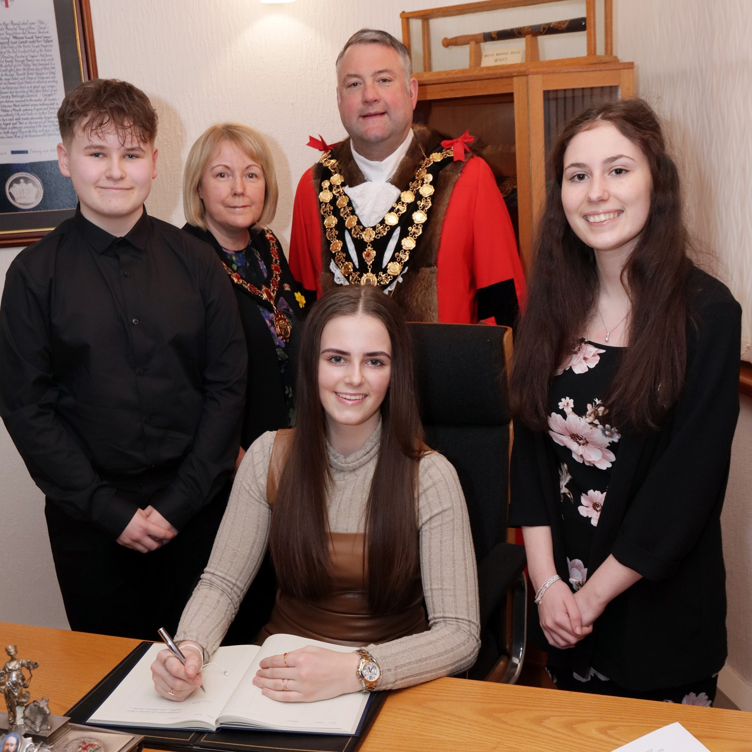 New Youth Mayor Gracie Jones with outgoing Youth Mayor Maddie Pritchard, new Deputy Youth Mayor Jake Dorgan, Mayor of Neath Port Talbot Cllr Chris Williams and Neath Port Talbot Chief Executive, Karen Jones. (Image: Neath Port Talbot Council)