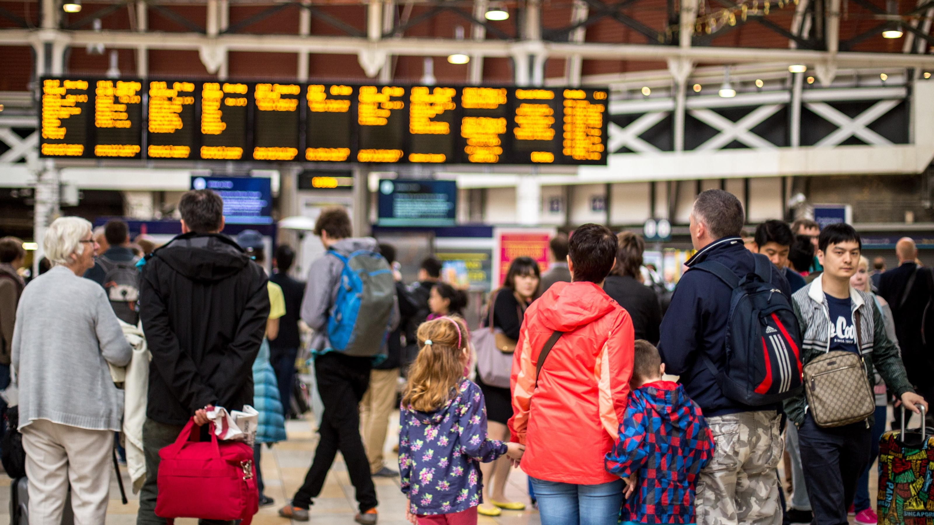 Family waiting at Paddington train station