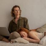 woman sleeping while lying on a man s lap