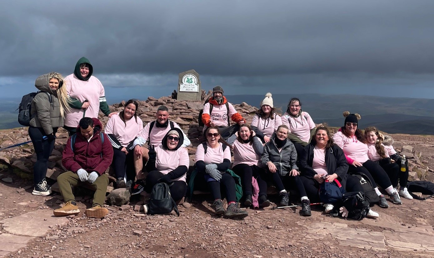 Dominique Miguel (back row third from left) and partner Jamie Stoneman (back row fourth) from left with friends at the summit of Pen y Fan