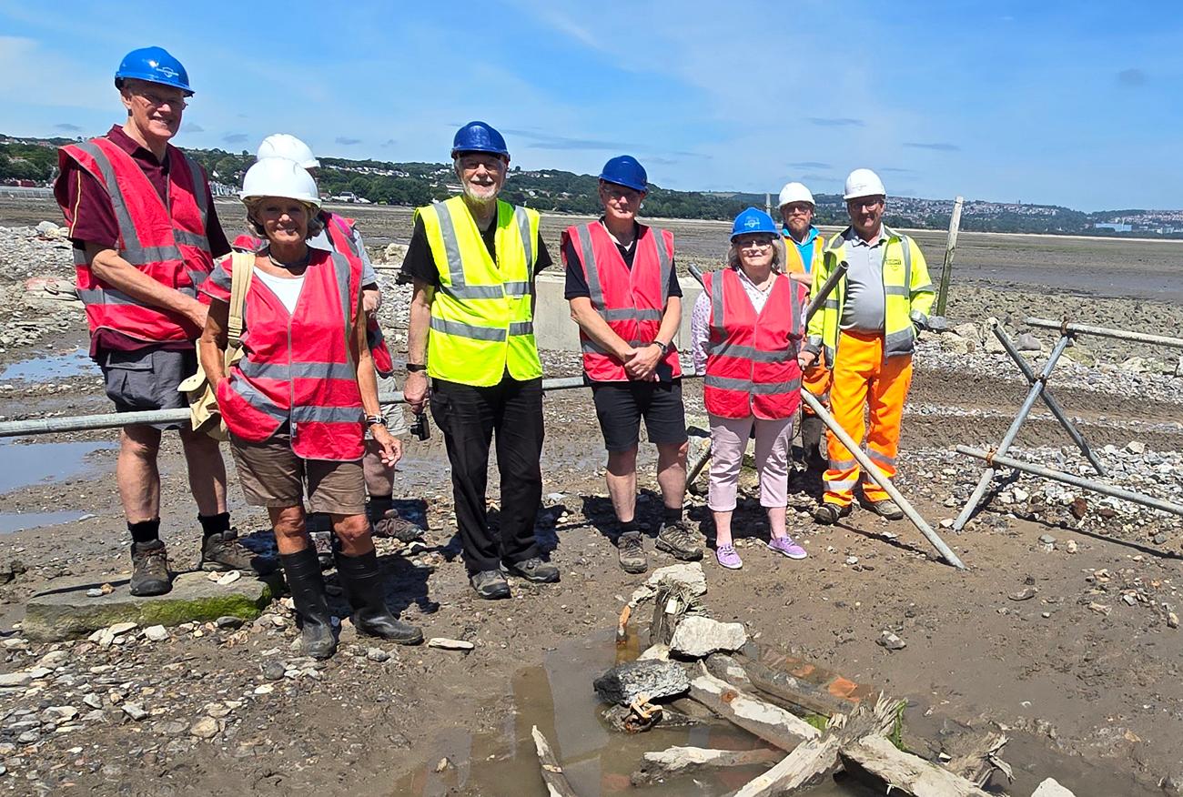 Members of The Story of Mumbles website are shown the remains of a boat from the community's former oyster fleet.