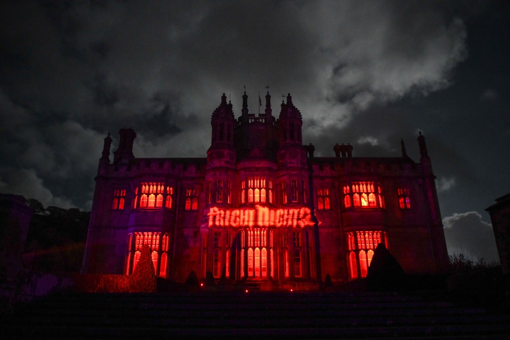 Margam Castle glows red for Fright Night — a haunted landmark hosting ghost hunts and Halloween events in Neath Port Talbot.