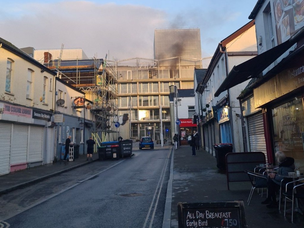 Smoke can be seen rising from the new office development on 71/72 Kingsway