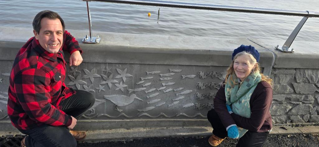 Council cabinet member Andrew Stevens and artist Catrin Jones with her new work on Mumbles prom.