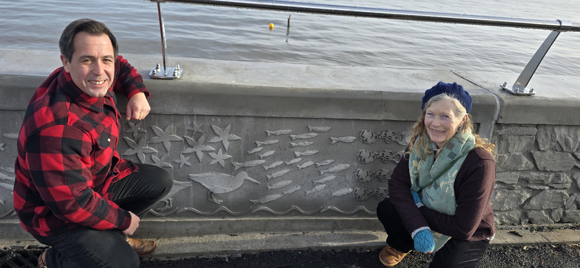 Council cabinet member Andrew Stevens and artist Catrin Jones with her new work on Mumbles prom.