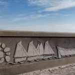 Artist, Catrin Jones' latest designs on the Mumbles sea defences include pebbles, oyster boats and a lifeboat.
