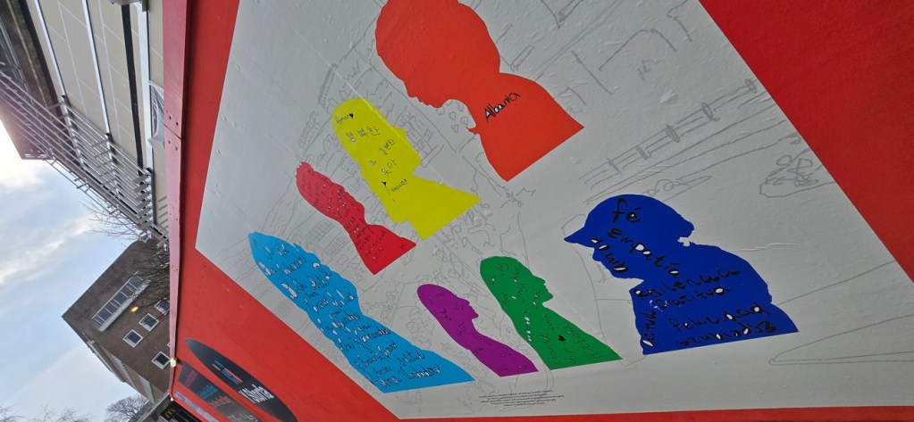 Examples of new public artworks installed on safety hoardings outside Swansea city centre’s emerging new community services hub Y Storfa. Pic: Swansea Council