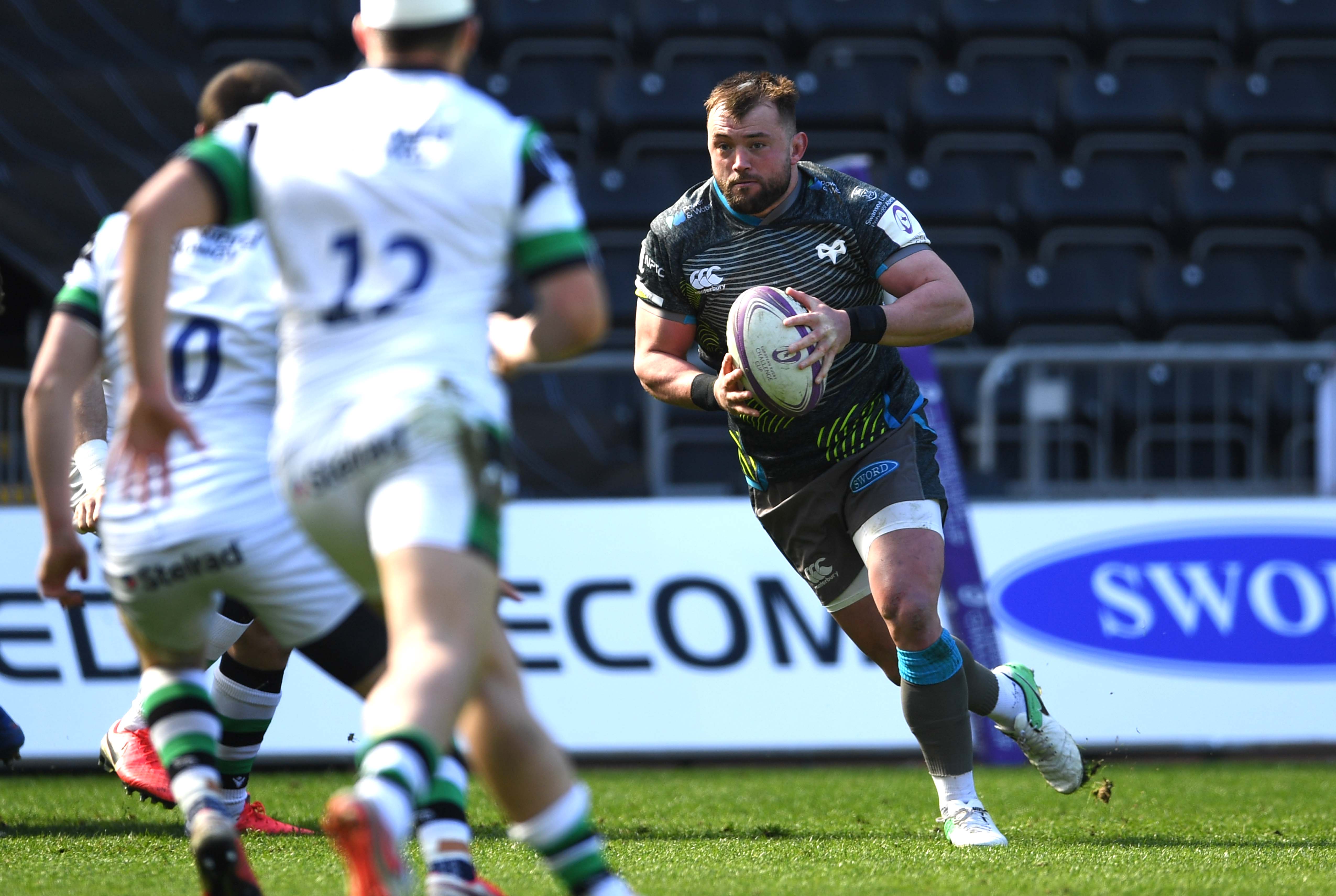 Sam Parry on the pitch during Ospreys match action. Image: Ospreys.