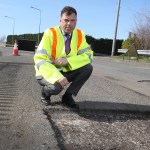Ken Skates with a road under repair
