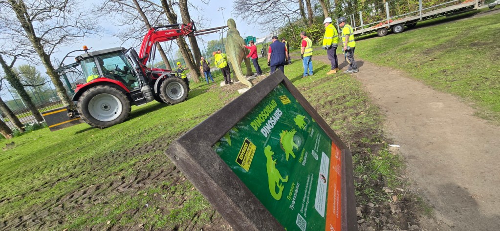 Council workers installing the dinosaurs