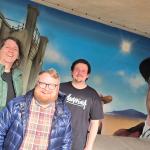 Swansea Council cabinet member Elliott King at the city’s new Amy Dillwyn mural with Ronny Oner and Ryan Lewis, of Oner Signs. Pic Swansea Council