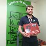 Adam, a beneficiary of Emmaus South Wales, holding a jigsaw — just one example of the many items available to borrow at a nominal fee from the newly launched