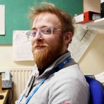 Aeron wearing the microphone attached to his jumper. This transmits directly to his hearing aids.