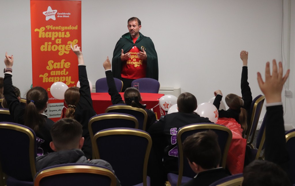 Andrew Jenkins takes questions from children at celebration event