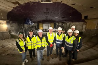 Representatives from Swansea Council, Beacon Cymru and Easyliving Ltd at the former Castle Cinema