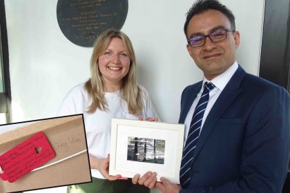 Nicola presents Mr Arya with a framed painting of Mumbles and, inset, her hand-written note.
