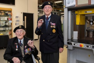 veterans-Ron-Horsey-and-Richard-Pelzer-show-the-first-VE-day-commemorative-coins