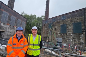 Swansea Council leader Rob Stewart, right, outside the city's Vivian and Musgrave Engine Houses with Mark Bowen, managing director, of main contractor Andrew Scott. Pic: Swansea Council