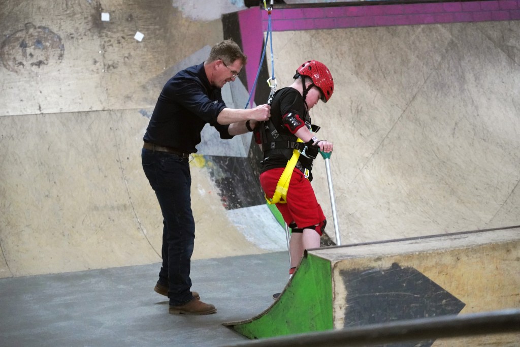 Ollie skating on the harness with Dr Ross Head