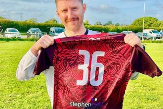 Henry Evans with team shirt sponsored by Stephen Evans Optometrists
