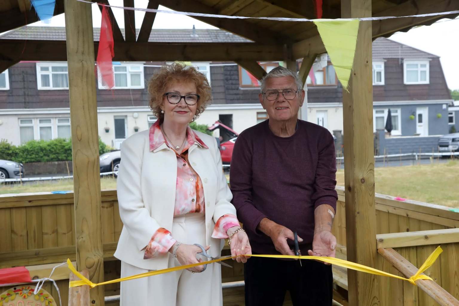 Councillor Jo Hale, Neath Port Talbot Council’s Cabinet Member for Adult Social Services and Alan Roberts, local resident and Chair of the Friends of Sandfields Community group, officially open Sandfields Community Garden.