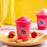 a cup of slushy on a plate