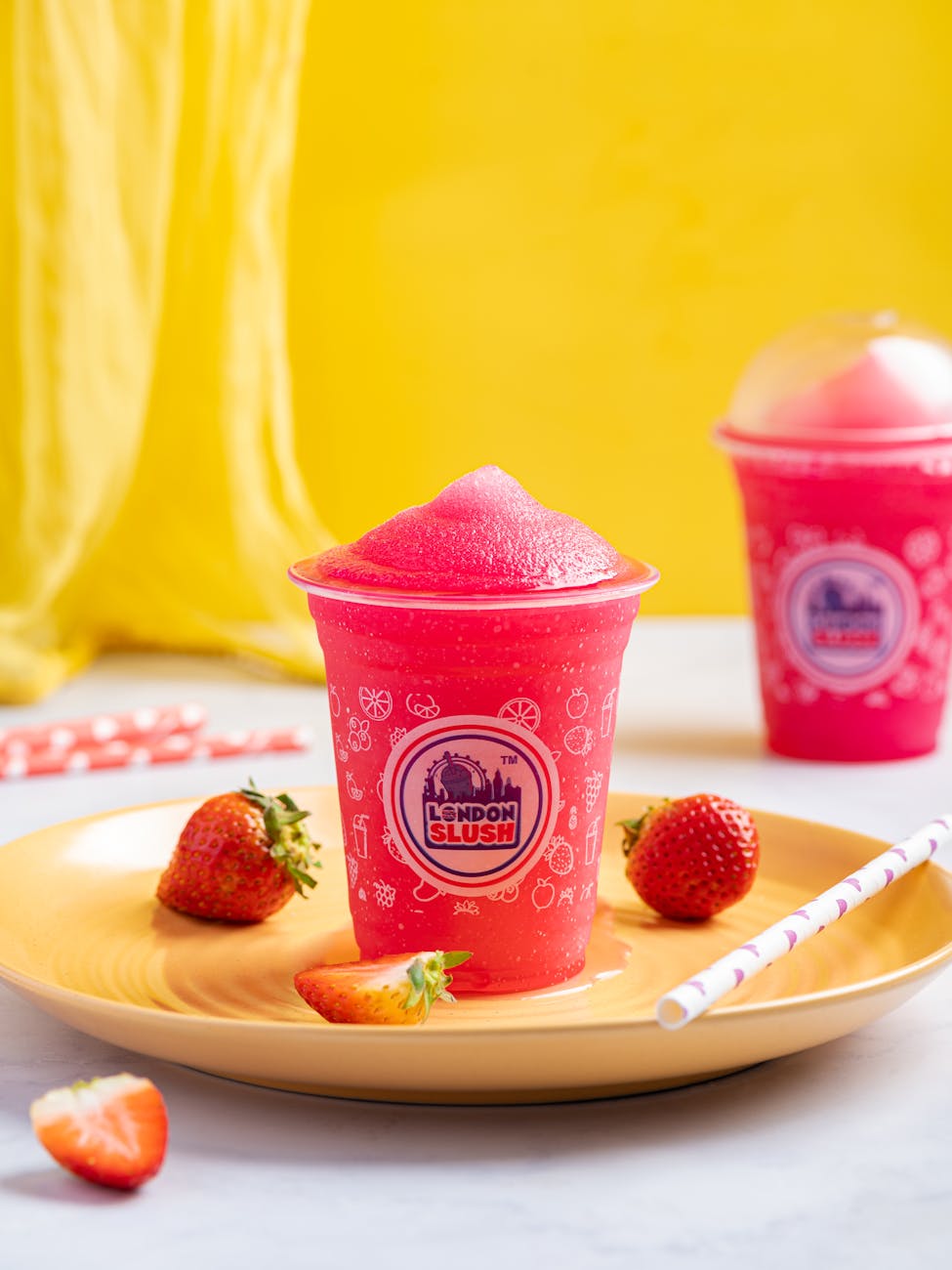 a cup of slushy on a plate