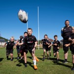 Howard Thompson (left) of Tata Steel subsidiary UKSE, Coach Ashley Jones, and some of the stars of the future