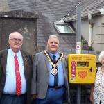 Bigyn Ward councillors Michael Cranham , Alan Williams, Janet Williams and David Darkin with Llanelli town mayor Andrew Bragoli with the new defibrillator at Glenalla Hall.
