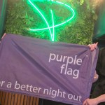 Jess, left, and Havana, of Wind Street's Peppermint Bar & Kitchen, fly Swansea's Purple Flag.