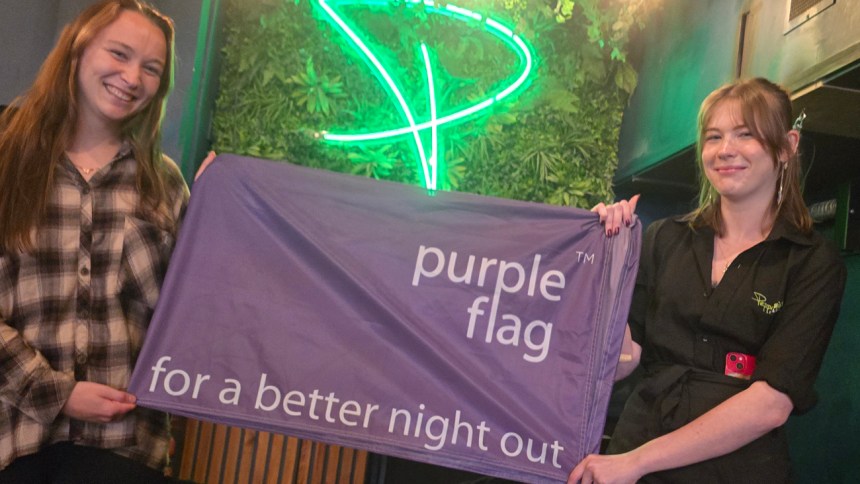 Jess, left, and Havana, of Wind Street's Peppermint Bar & Kitchen, fly Swansea's Purple Flag.