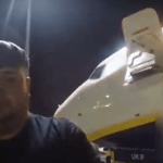 Joshua Pope being hauled off a plane by police