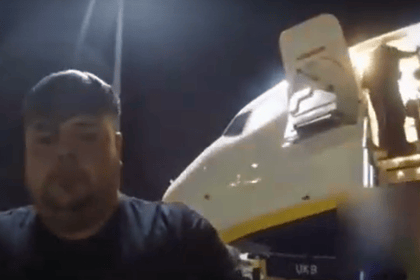 Joshua Pope being hauled off a plane by police