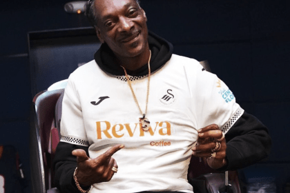 Snoop Dogg wearing a Swansea City shirt