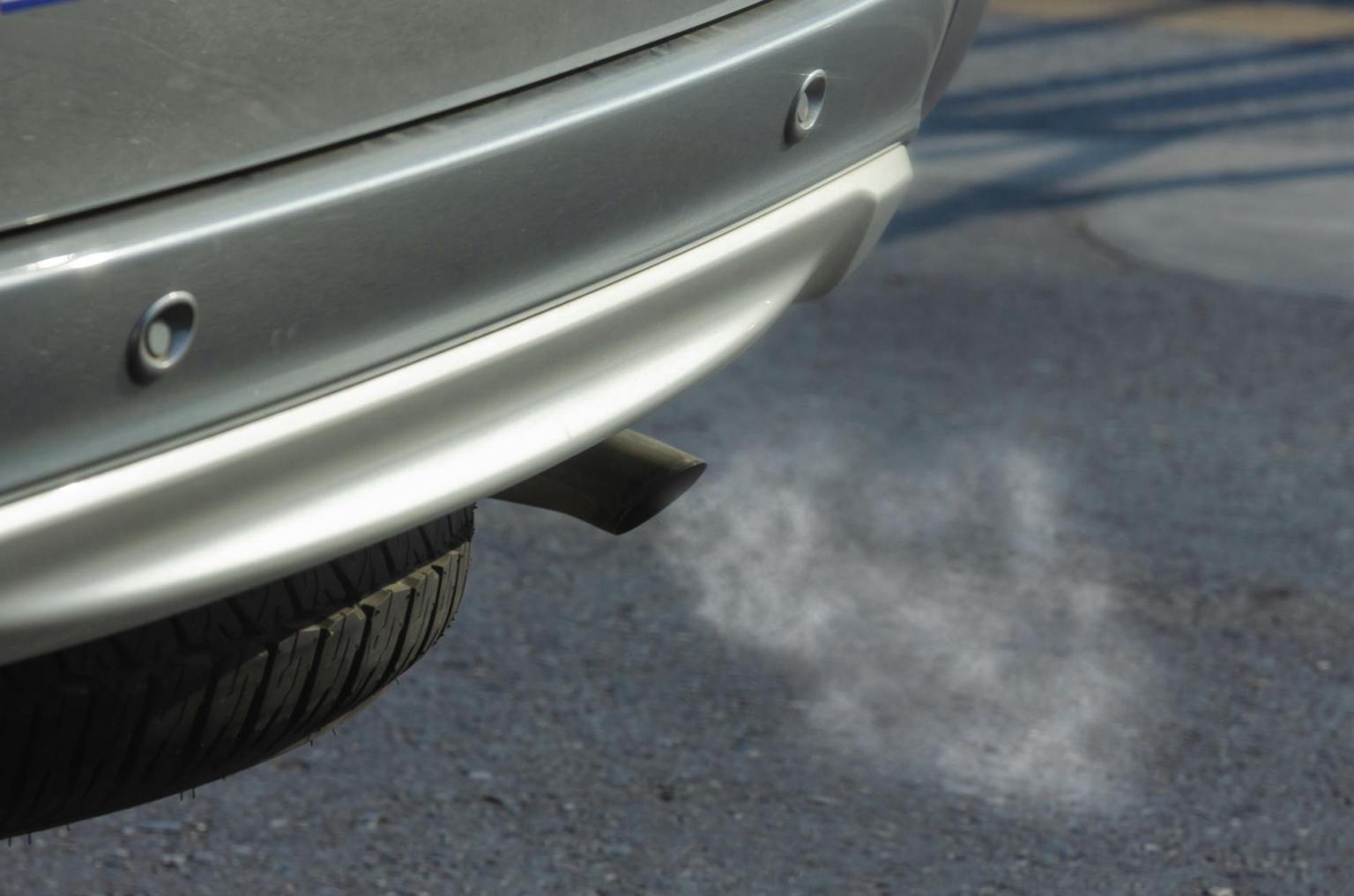 silver car with black exhaust pipe