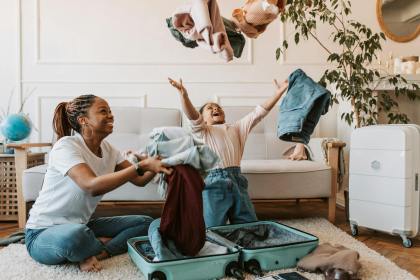 mother and daughter playing with clothes