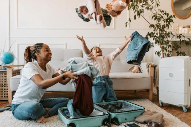 mother and daughter playing with clothes