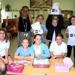The pupils and Miss Elliw Roberts at their stall