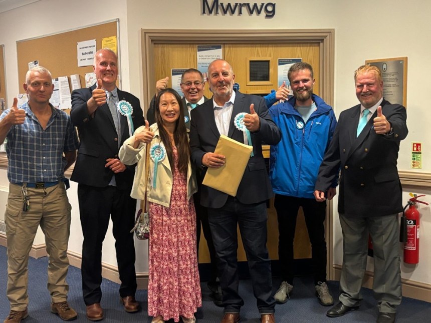 Reform win the Llangennech by-election and gain another seat on Carmarthenshire Council. Councillors Michelle Beer and newly elected Carmelo Colasanto pictured centre.