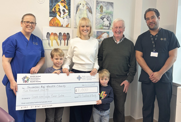 Maureen's husband Nigel Craddock, daughter Jennie Palmer and her children Isaac and Lucas, along with clinical nurse specialist Julie Johns and consultant oncologist Steve Kihara